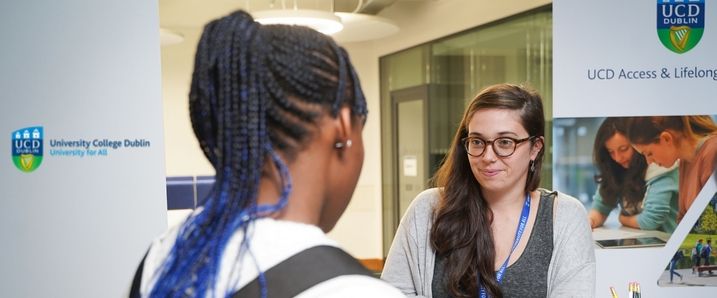 A prospective student attending an outreach event