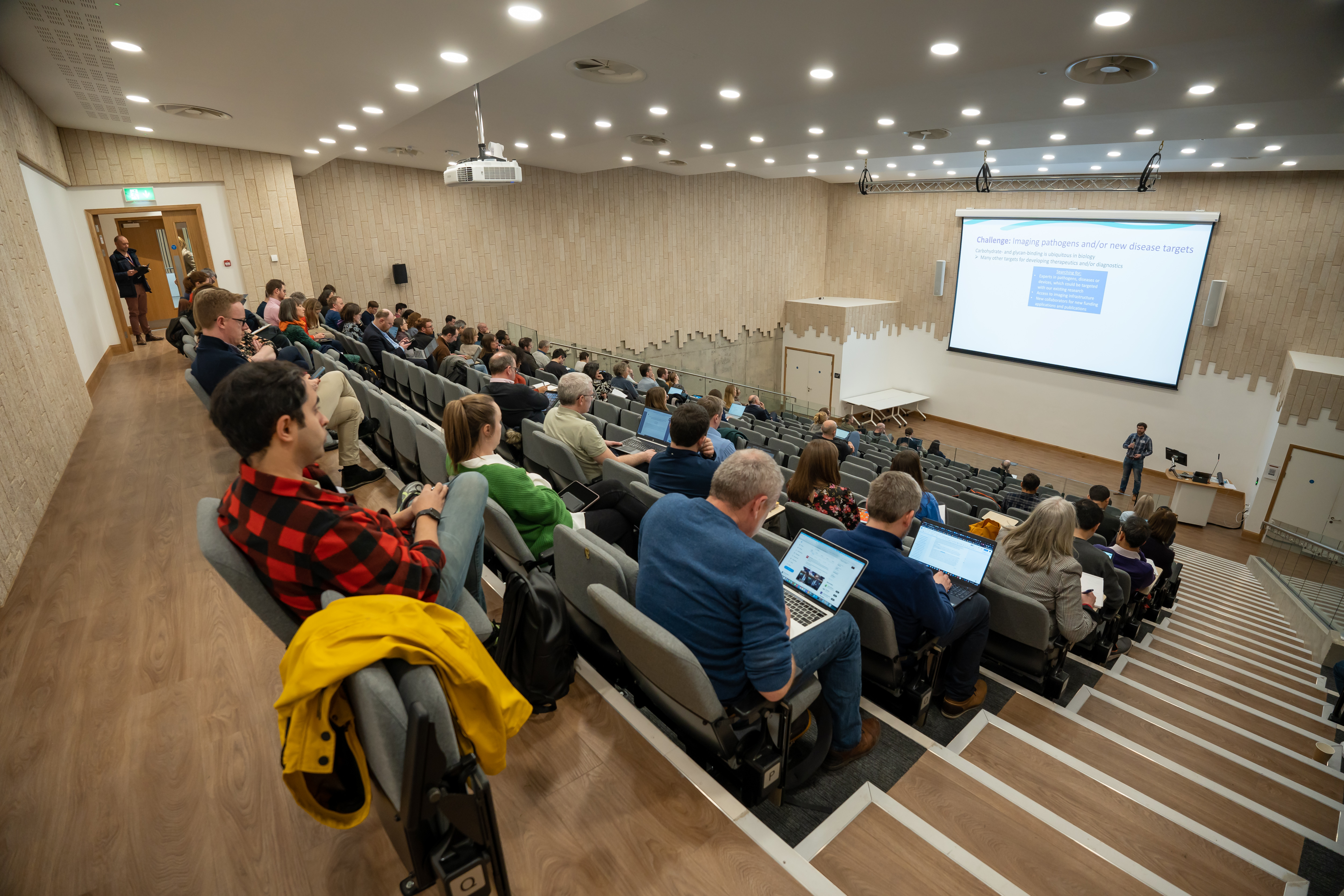 people watching presentation in auditorium