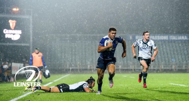 Adam Byrne playing rugby