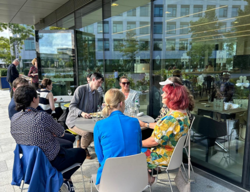 Group of staff sitting around table