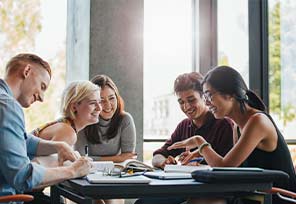 Students studying together and having a laugh.