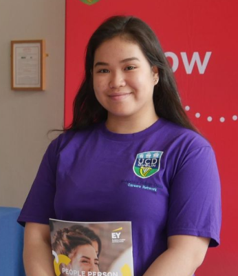 A woman in a purple tee shirt